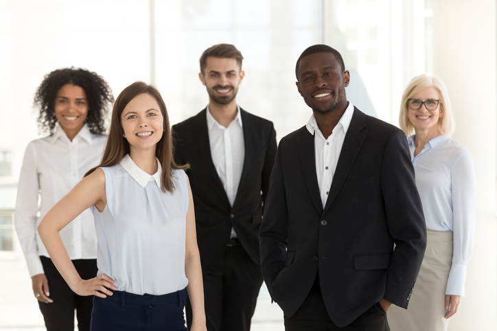 Group of solicitors standing and smiling at camera